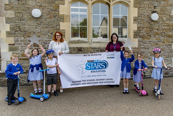 St Mary’s C of E Primary School pupils and staff show off their new rating.