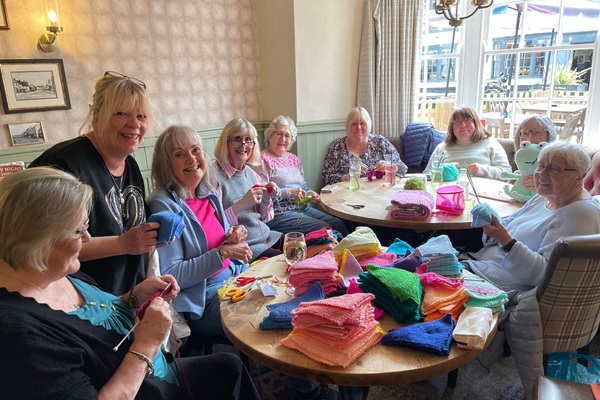 A GROUP of 16 knitters who meet at the Swan pub in Thornbury have raised £2,100 for charity Sarcoma UK with an 18-hour knitathon
